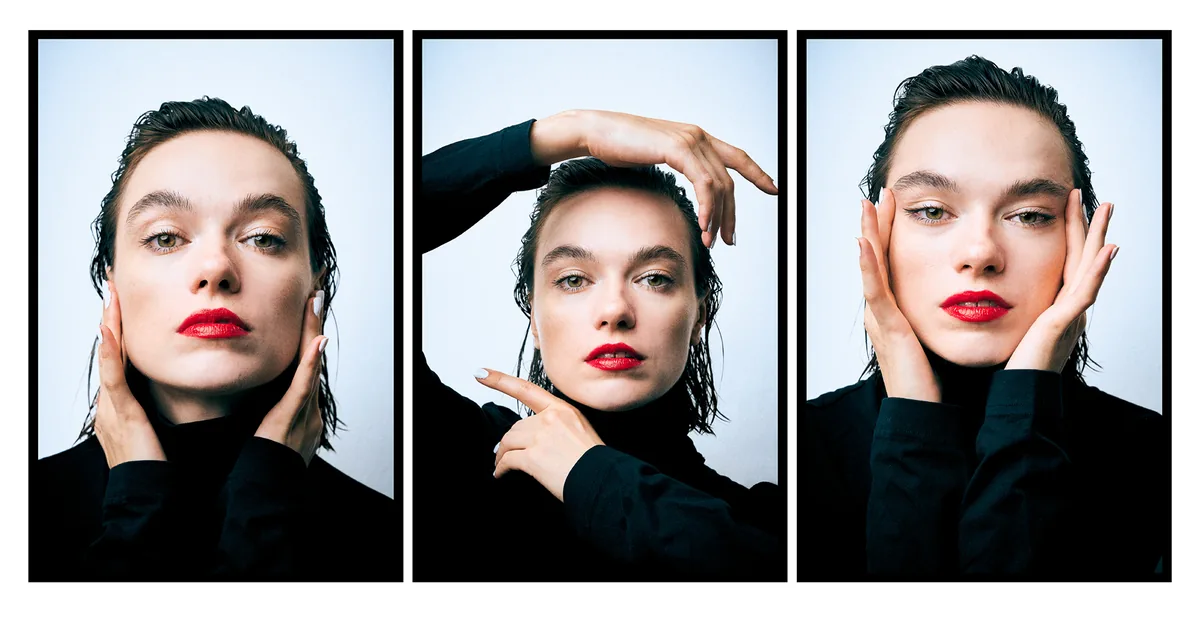 Three portraits of a young woman with wet hair and red lipstick, hands at her face, black turtleneck, pale blue backdrop