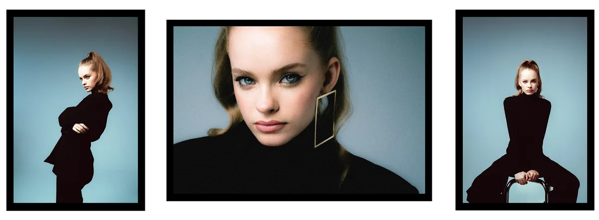 Three portraits of a young woman with a high ponytail, in black, with a large rectangular earring, blue-grey backdrop