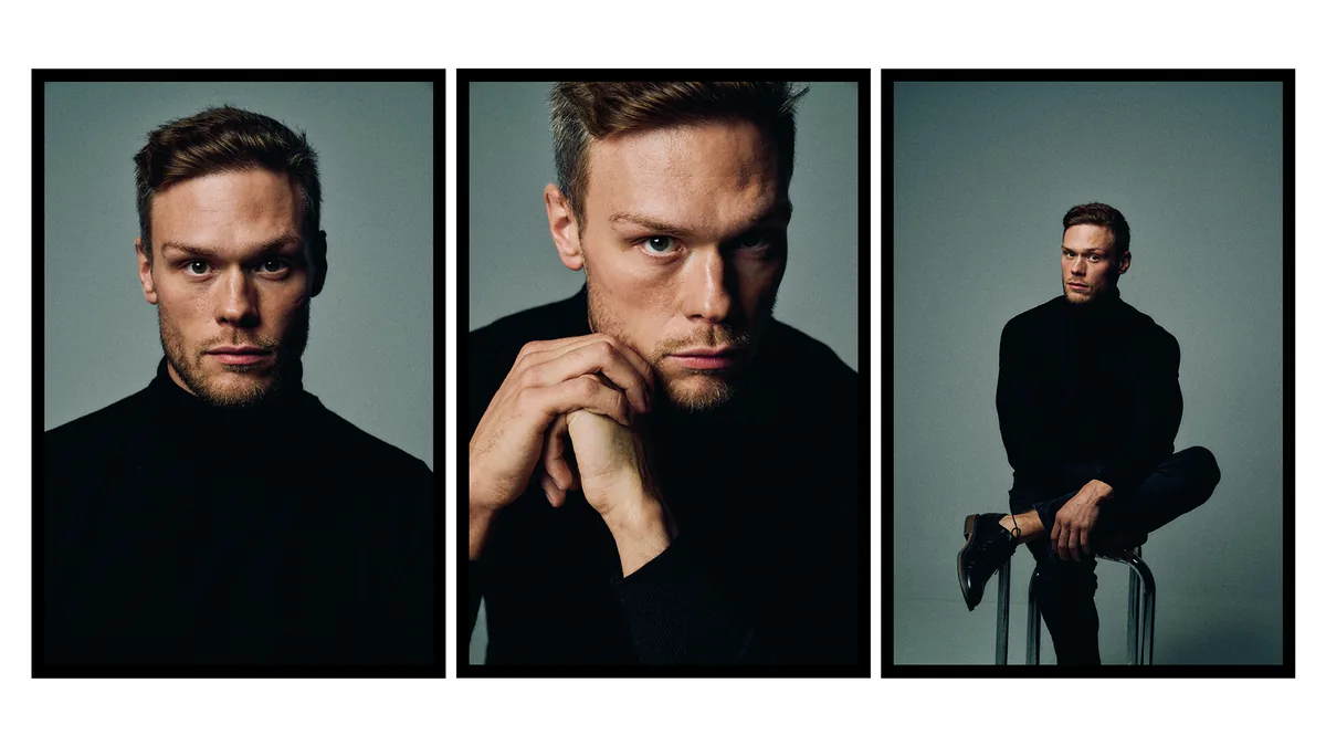 Three portraits of a man with short hair and stubble in a black turtleneck, the last on a chrome stool, grey-green backdrop