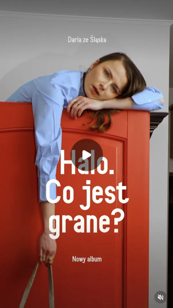 Reel: a woman in a light blue shirt draped over a red wardrobe, large text overlaid on the frame