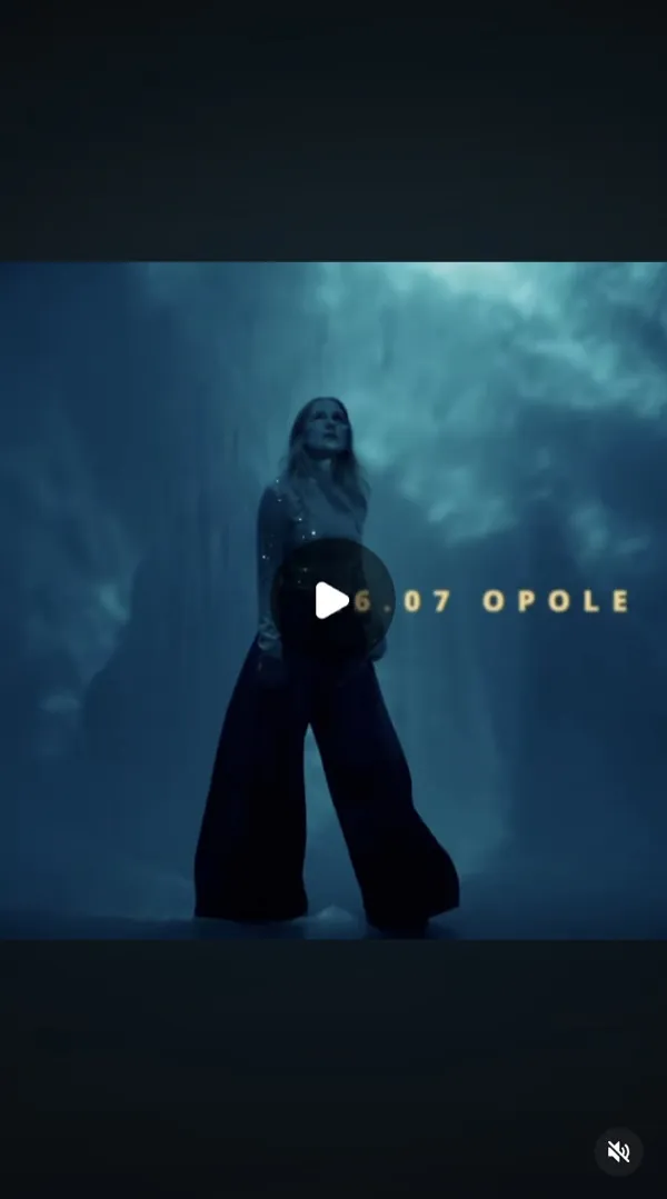 Reel: a woman in wide trousers and a sparkly top in blue haze, caption with a date and a city name
