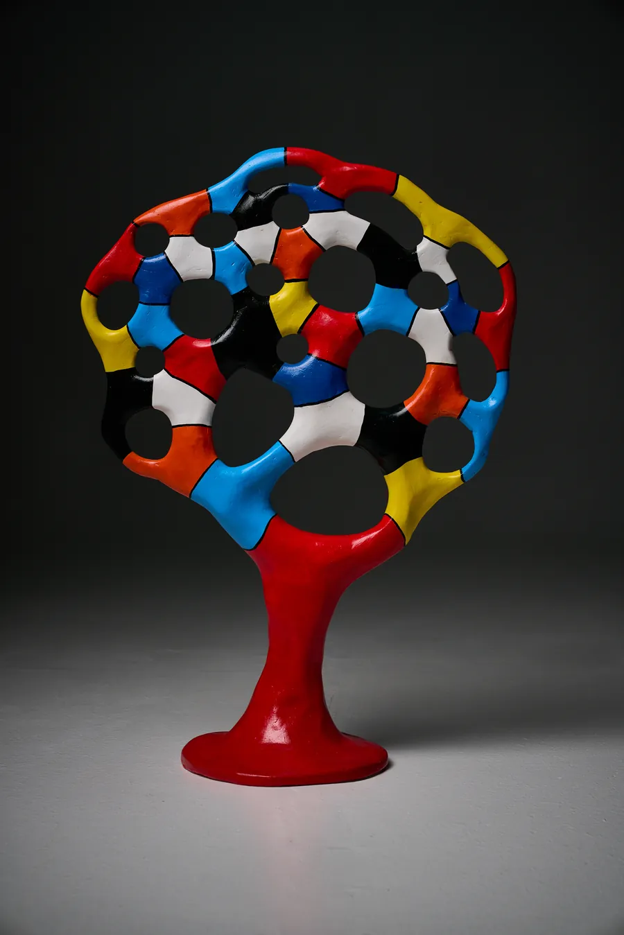 BARCELONA, airdry clay, 55x79 cm — openwork object: a layer of colour patches above a glossy red base