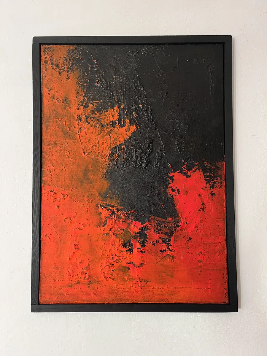 IN IGNE, acrylic on canvas, 50x70 cm — heavy texture: black above, orange on the left, red below, black frame